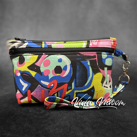 graffiti print wristlet purse